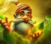 An animated gnome, known as the Kratom Genie, with a long beard and hat holds a glowing green leaf amid swirling mist against a warm, mystical background.